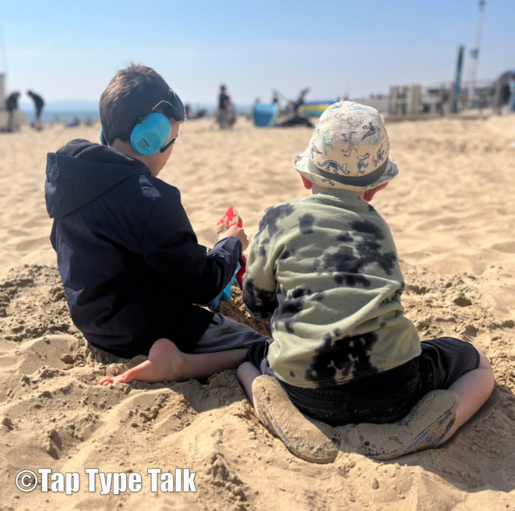 Never give up - autistic boy and his brother playing in the Bournemouth sand for the first time together.
